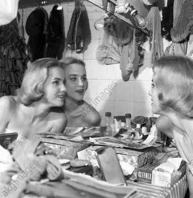 Alice and Ellen Kessler, twin sisters and german artistic duo, posing in the dressing room at the Lido in Paris